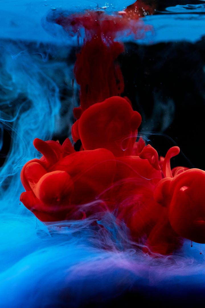 Pigment in water — the brand mark in motion.