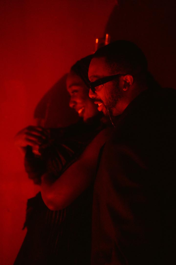 Embrace in red — late hour.