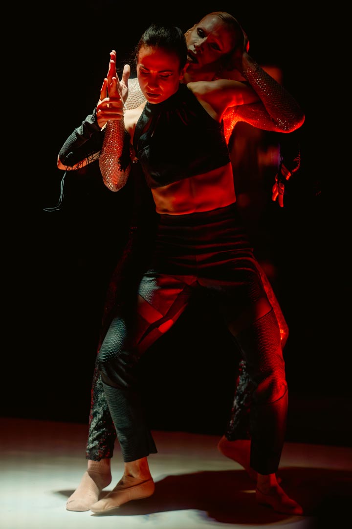 Duet — tension in red light.